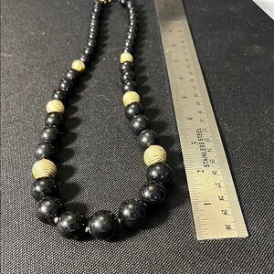 Vintage black graduated beaded necklace with Goldtone accents.